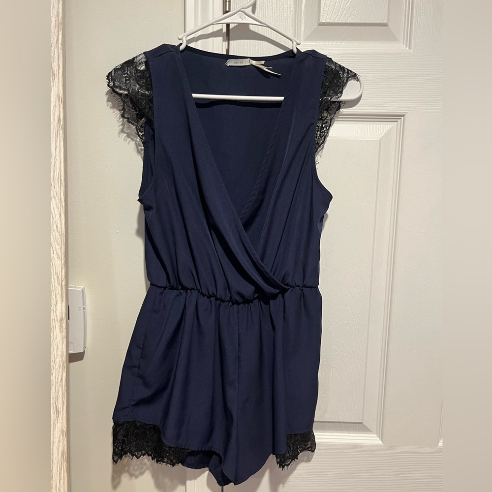 Silky romper with lace detail on shorts and sleeves